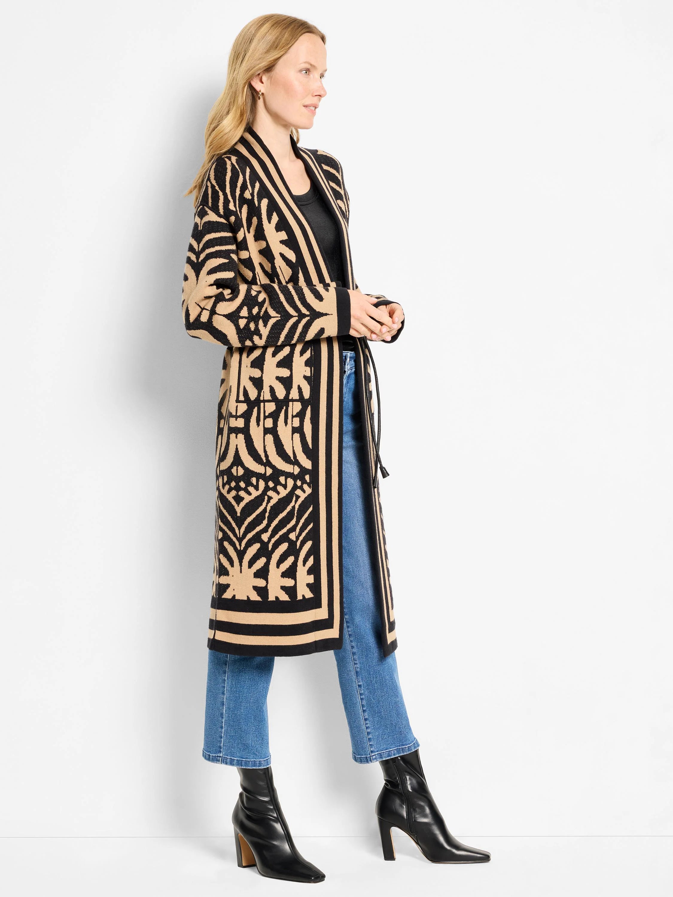 Long black and beige open jacket with intricate abstract pattern and striped borders, reaching mid-calf.