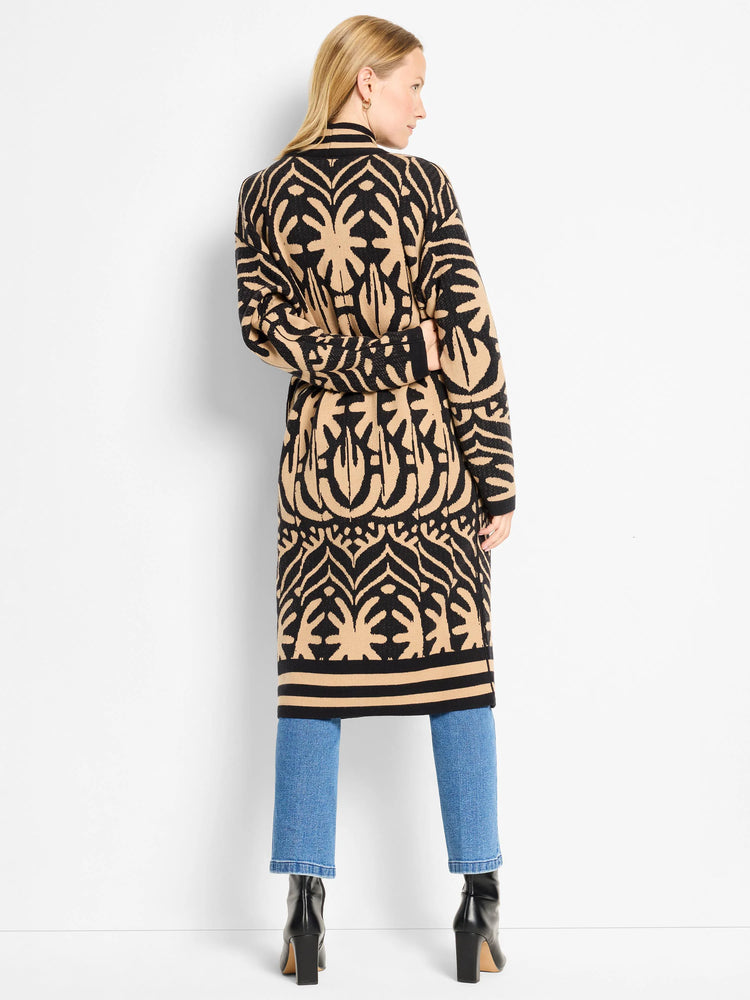 Black and tan long jacket with an abstract pattern, cinched at waist.