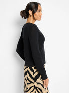 Black open-knit cardigan with subtle sparkle.