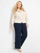 Creamy beige open-knit cardigan with a button front and ribbed trim.