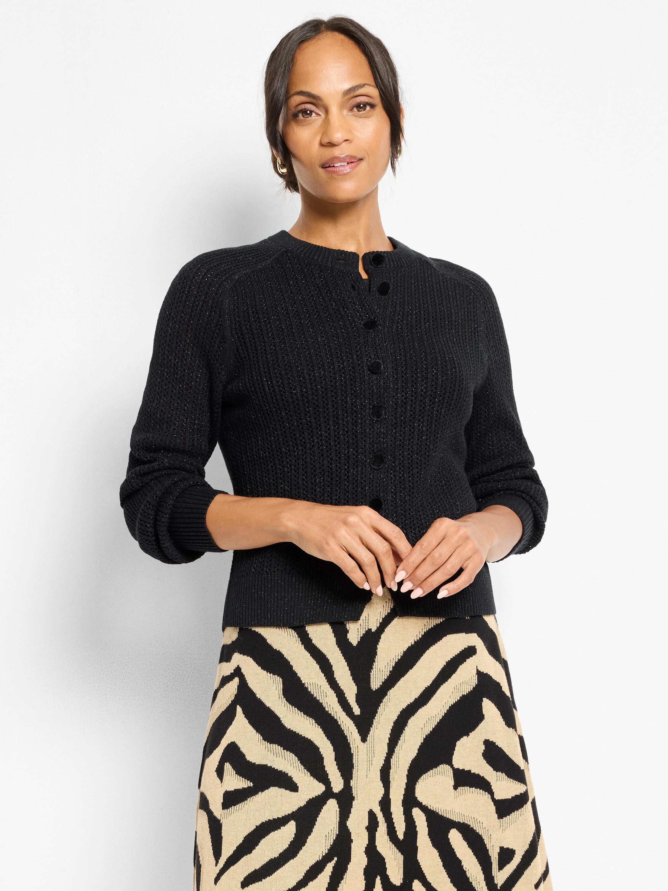 Black textured jacquard cardigan with subtle sparkle. Round neck, long sleeves, and dark buttons.