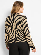 Beige and black jacquard cardigan with distinct zebra stripes.
