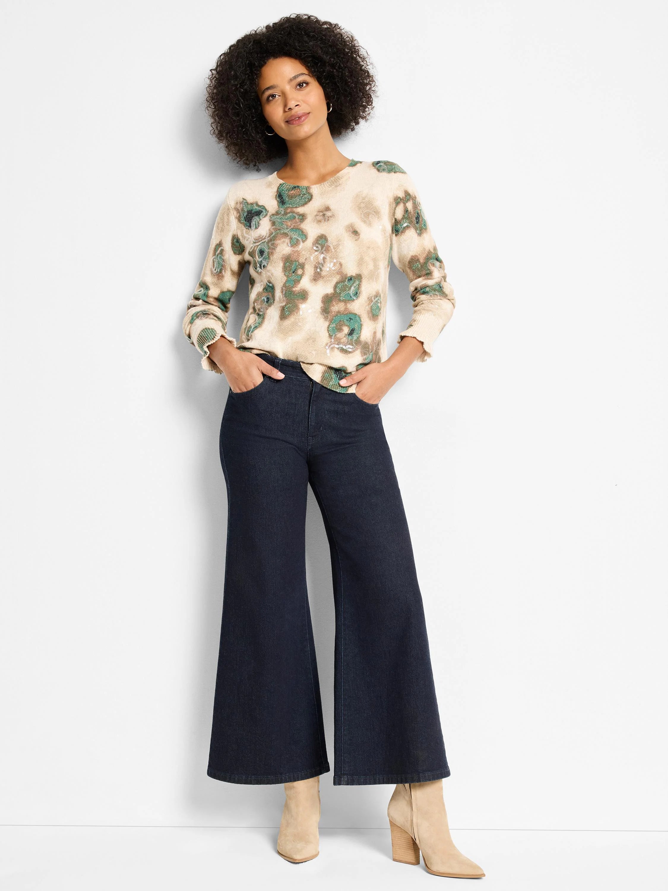 Cream sweater with abstract green and brown camo-like pattern, scattered with subtle sequins. Ribbed cuffs.