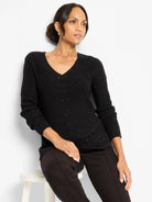 Black waffle V-neck sweater with subtle silver shimmer.