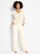 Cream shimmer waffle V-neck sweater.