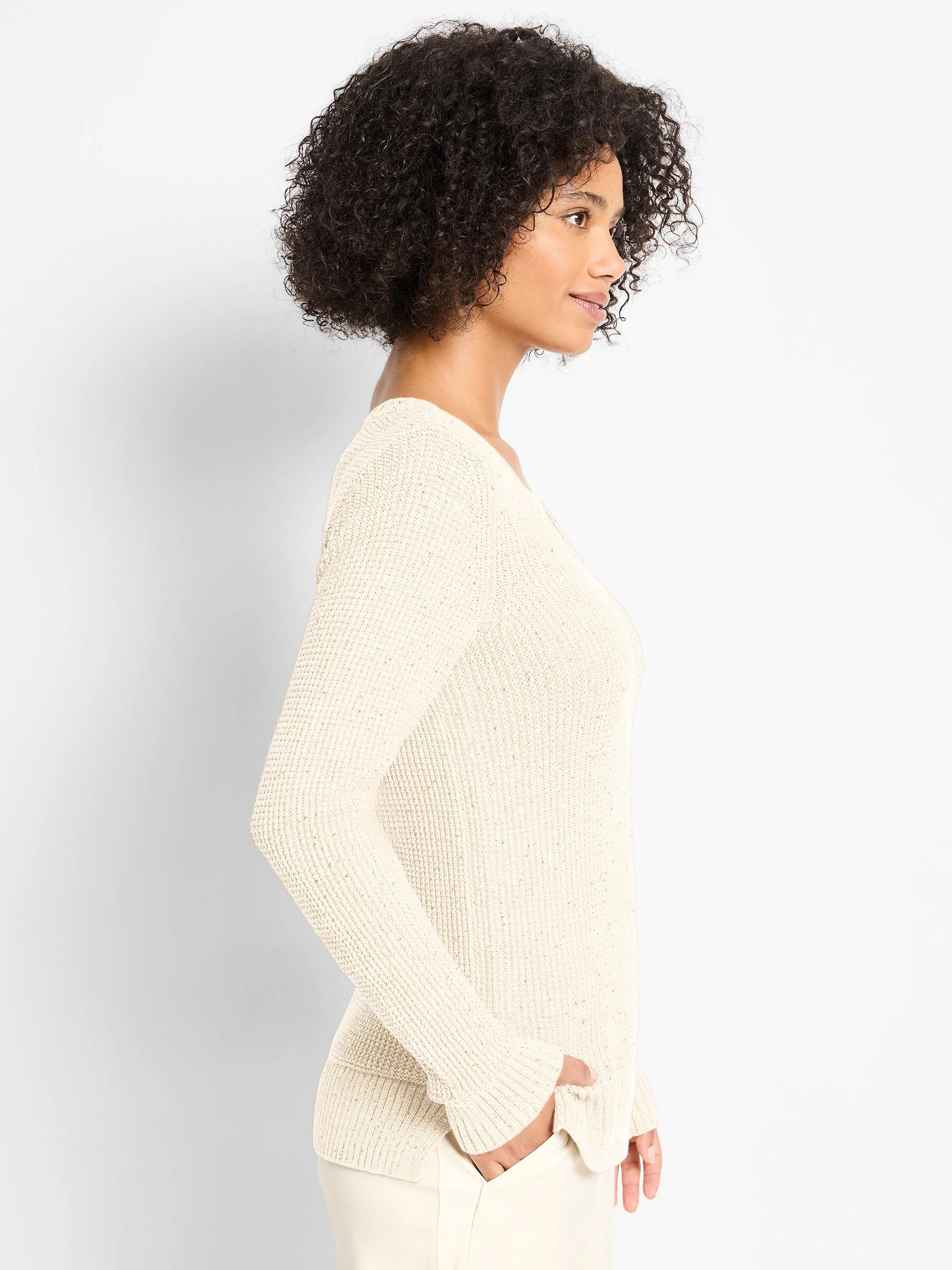 Ecru, subtly shimmering waffle knit V-neck sweater. Long sleeves, relaxed fit.
