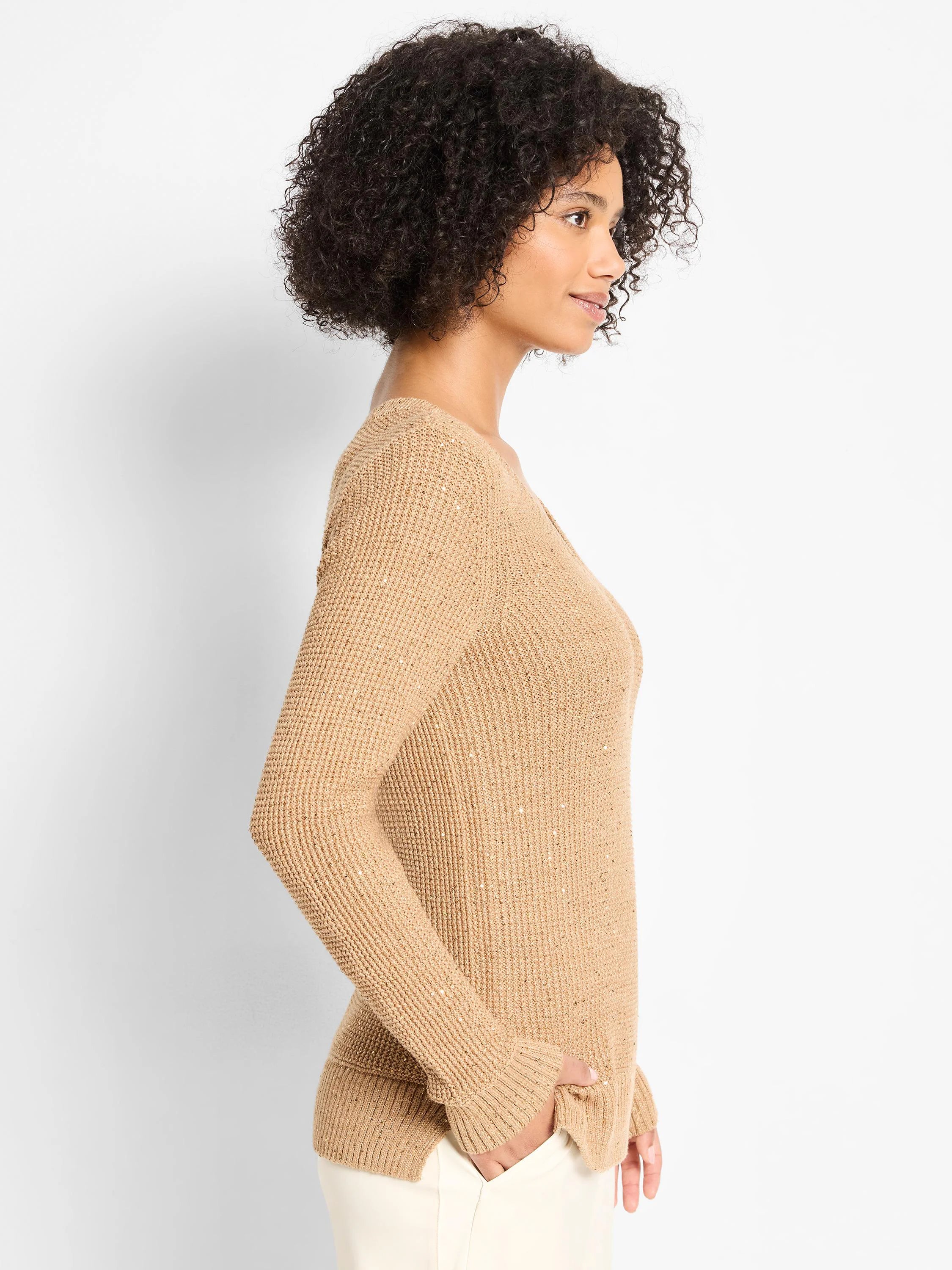 Tan V-neck sweater with a waffle knit texture and shimmering flecks, shown on a model.