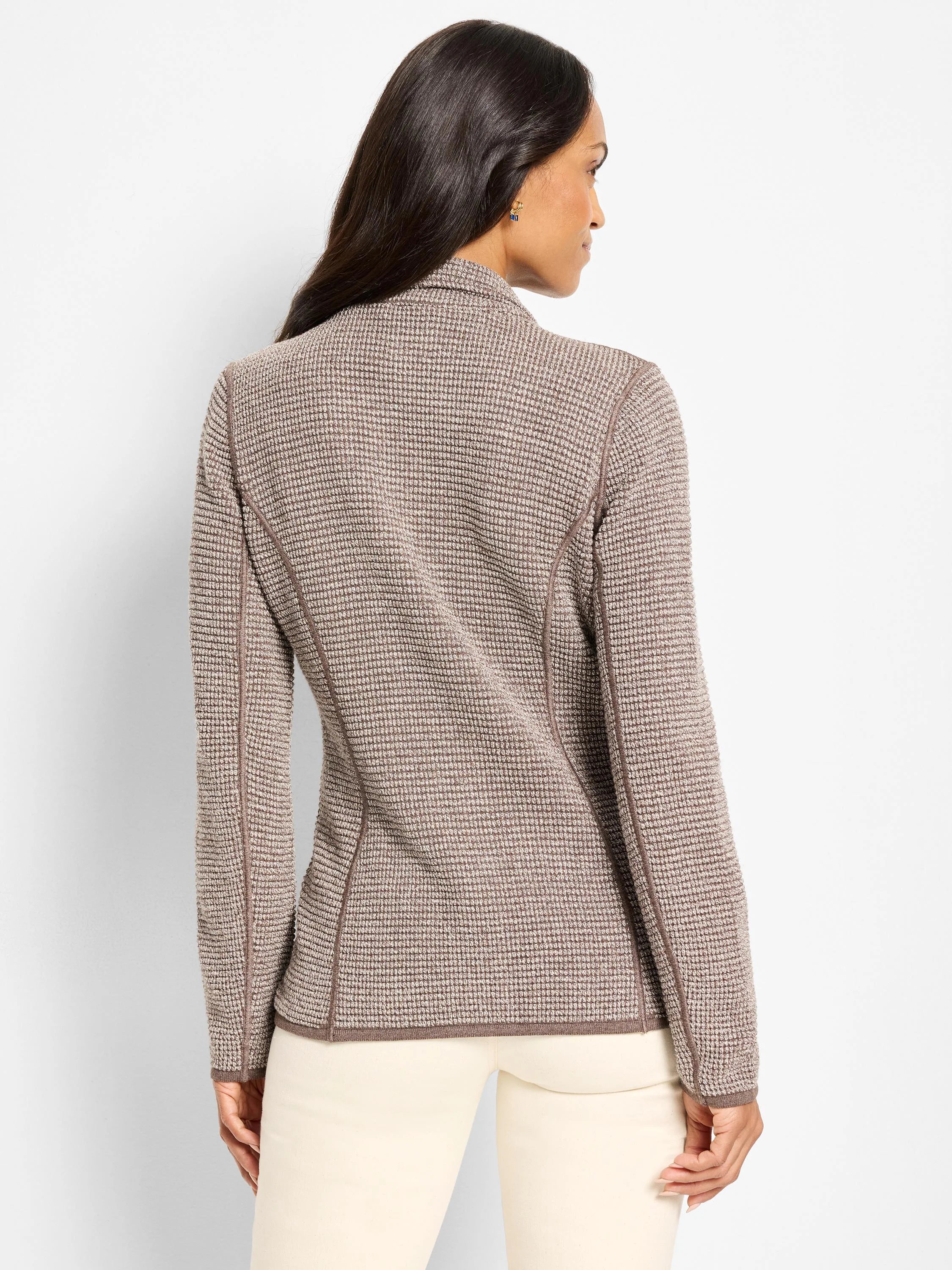 Tan and brown pixel knit jacket with a stand collar and dark brown accent trim. Close-fitting silhouette.