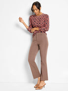 Ikat pattern sweater in red, orange, tan, and navy. Long sleeves, round neck.