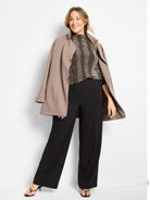 High neck ombre pixel knit sweater in brown, beige, and black gradient pattern.