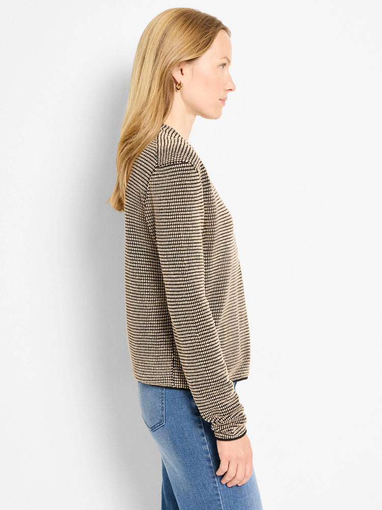 Black and tan textured cardigan with a small, all-over pixel pattern. Features ribbed black cuffs and hem.