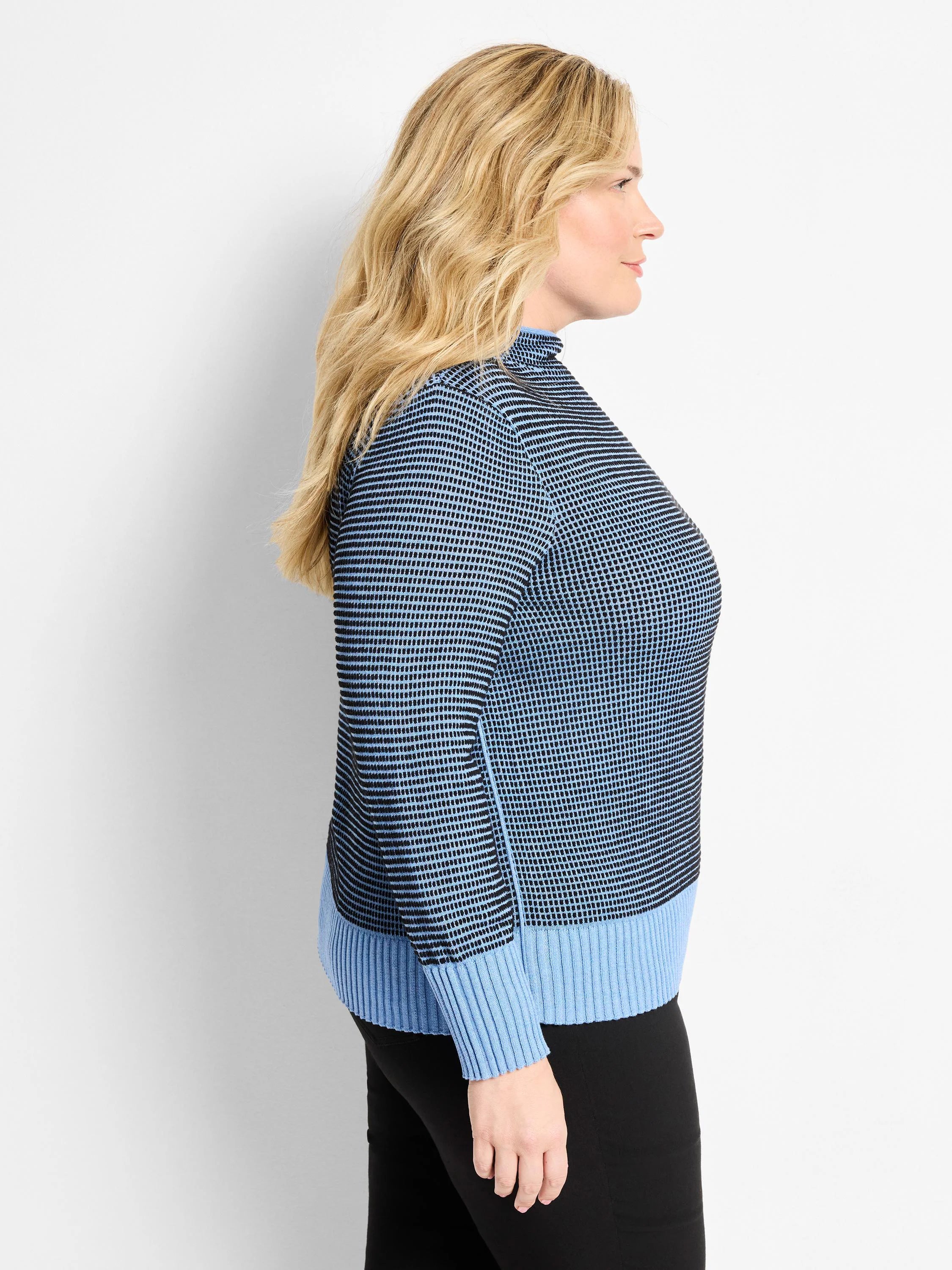 Funnel neck sweater in dark & light blue pixel knit. Solid light blue ribbed cuffs, hem, and side panels.