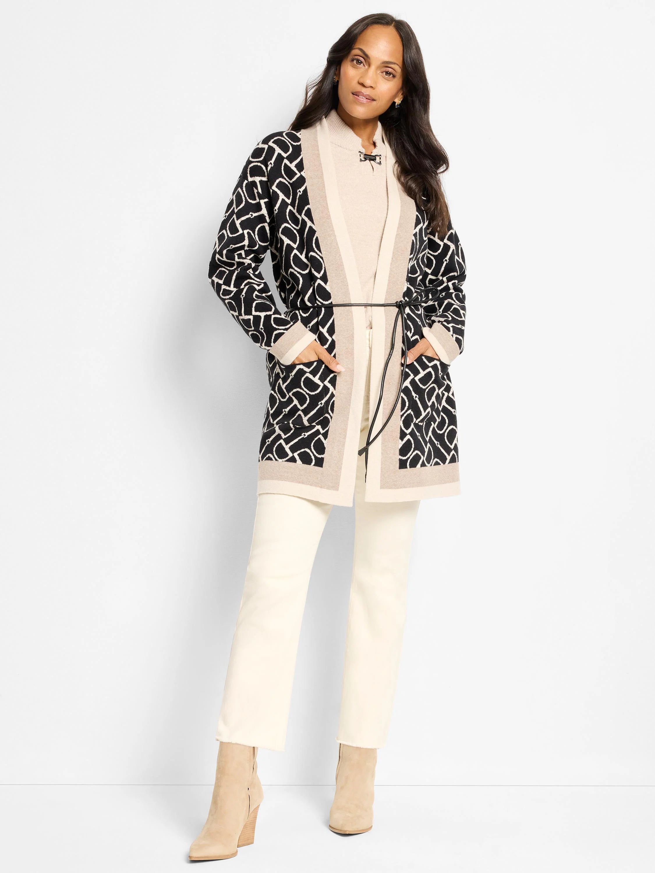 Long black & cream equestrian print jacket with beige trim. Features thin black belt, open front, and patch pockets.