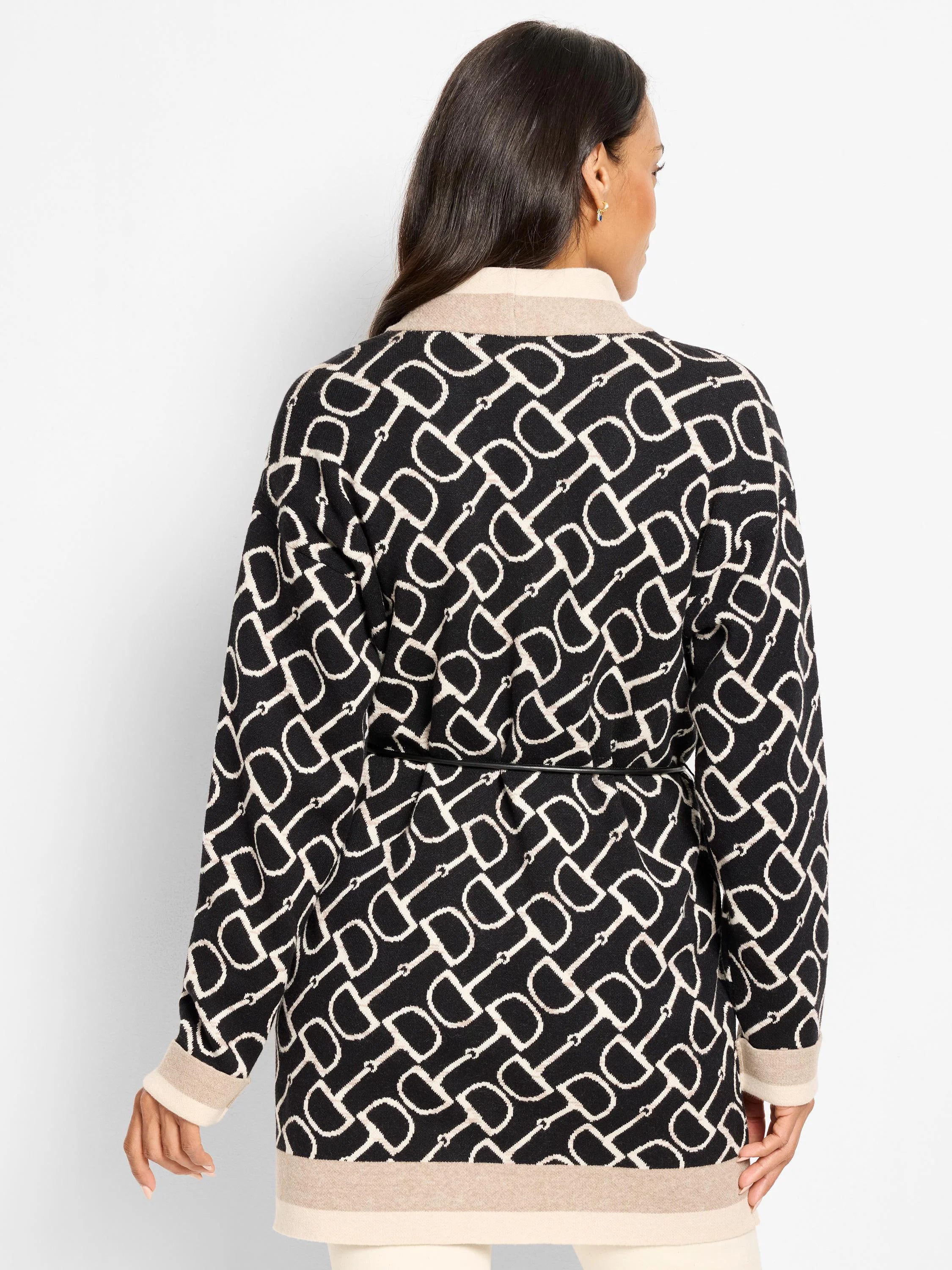 Black & cream horse bit pattern jacket with thin black belt, beige collar, cuff, & hem trim.