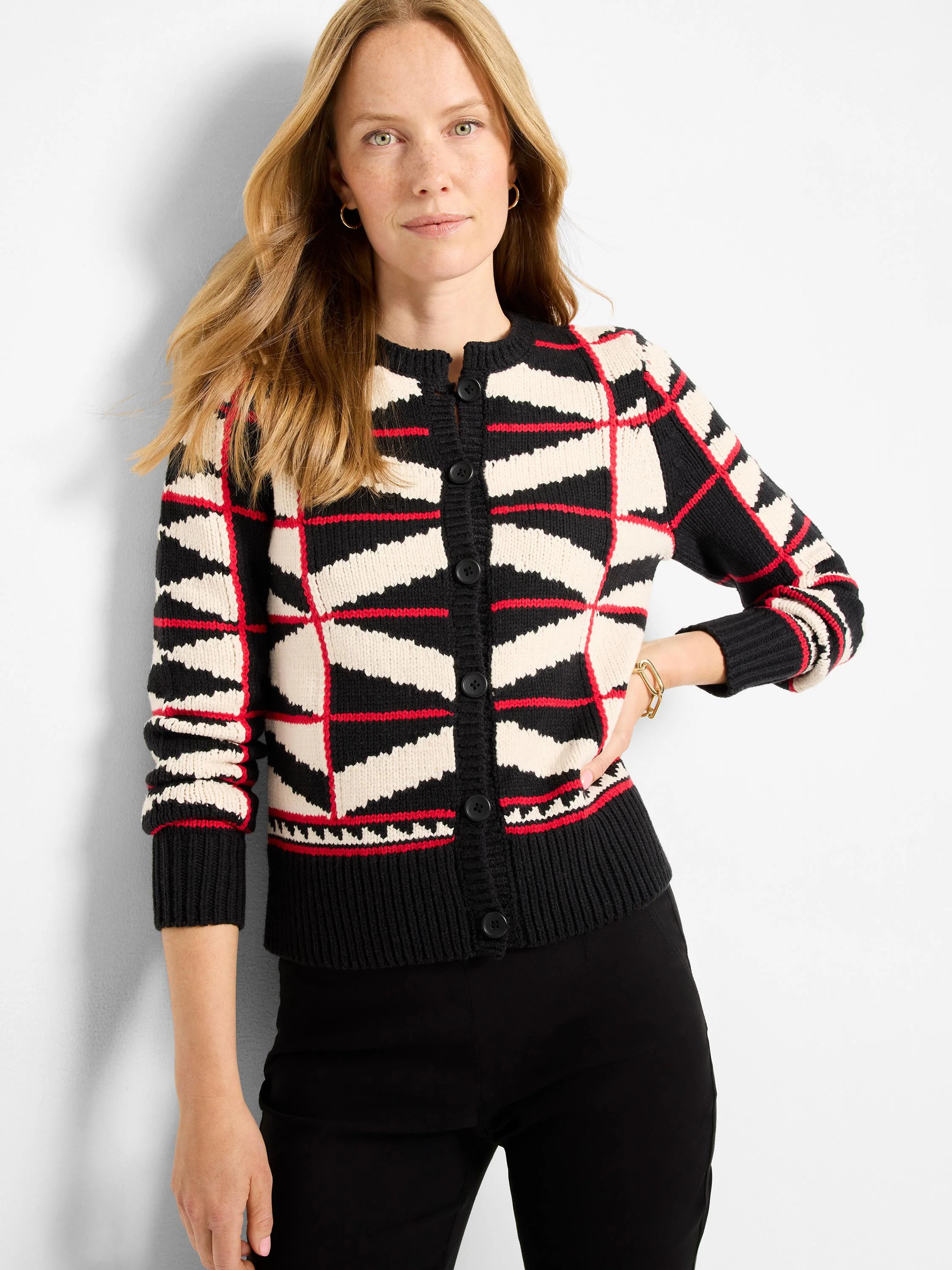 Black, cream, and red geometric cardigan with angular patterns, button front, crew neck, and ribbed hems.