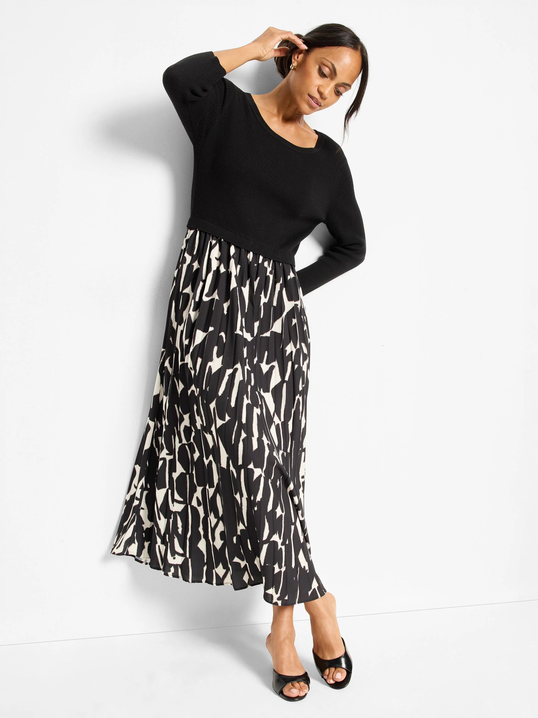 Black ribbed top dress with a cream and black abstract printed, pleated maxi skirt.
