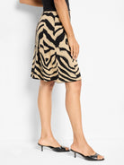 Black and tan zebra jacquard knit A-line skirt, knee-length.