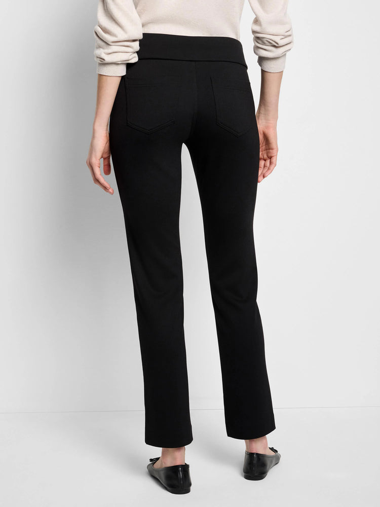 Black straight-leg pants with a pull-on waistband and back pockets. Model is wearing flats.