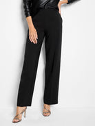 Black wide-leg, high-waisted pants with a sleek finish and pressed front creases.