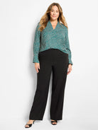 Black, sleek, full-length, wide-leg pants.