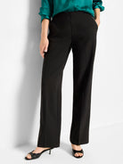 Black wide-leg pants. High-waisted, flat front with a sharp center crease down each leg. Smooth, matte fabric.