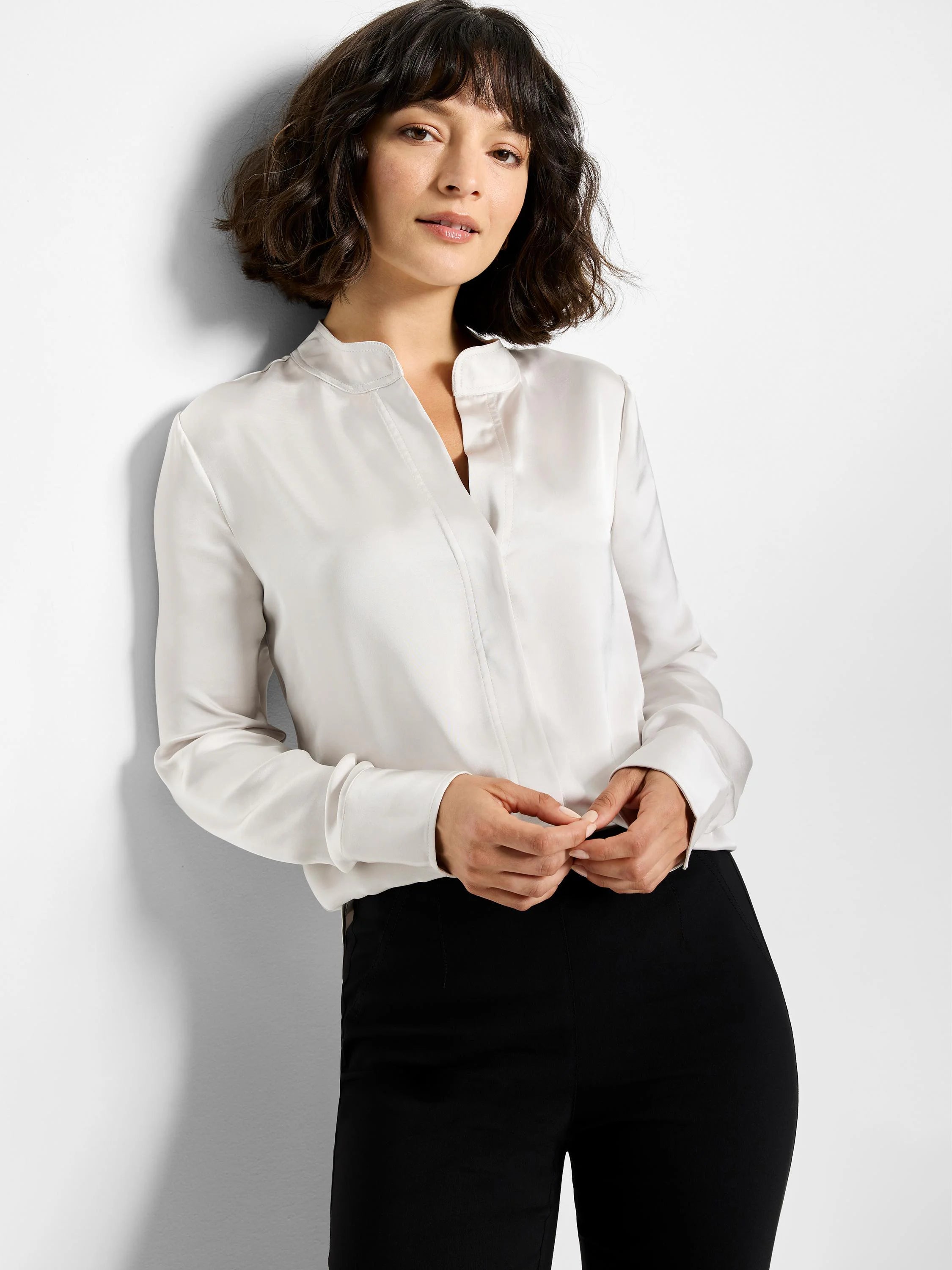 Off-white, long-sleeved satin shirt.  Mandarin collar, V-neck placket.