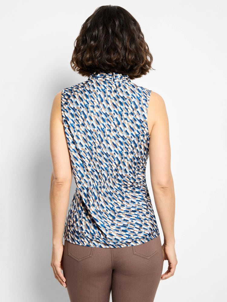 Sleeveless, ruffled neck top. Blue, beige, and white brushstroke pattern. Back view.