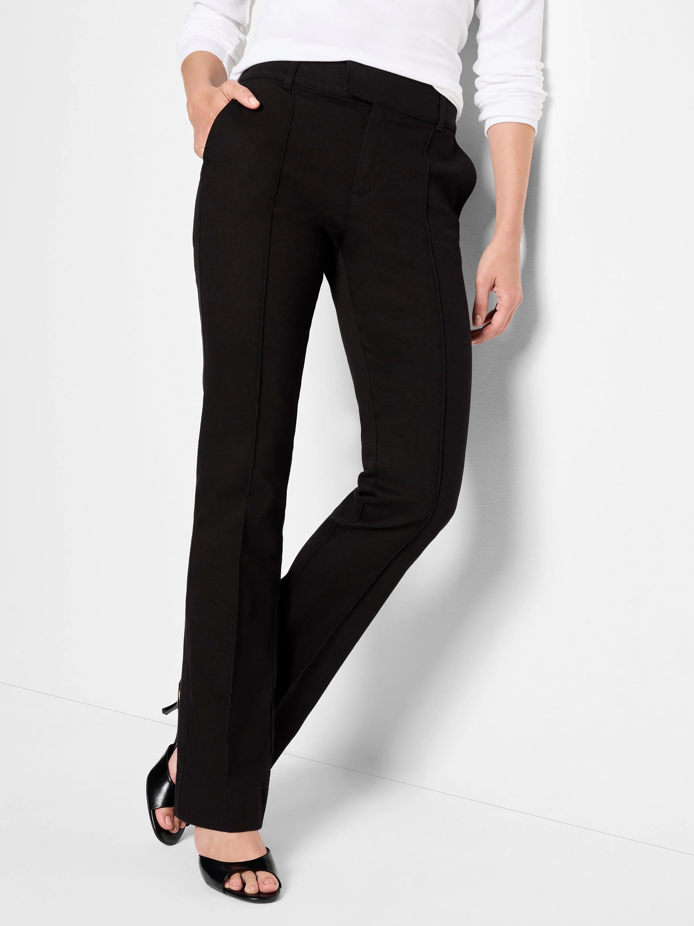 Black bootcut trousers; mid-rise waist; straight legs slightly flared at the ankle.