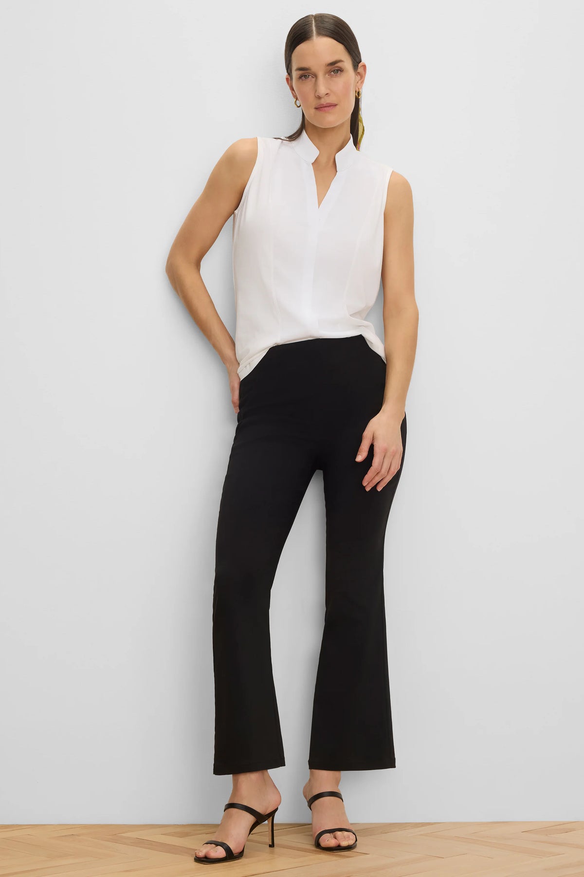 Black bootcut pants, 28-inch inseam, fitted through the thigh, with a slight flare at the ankle.