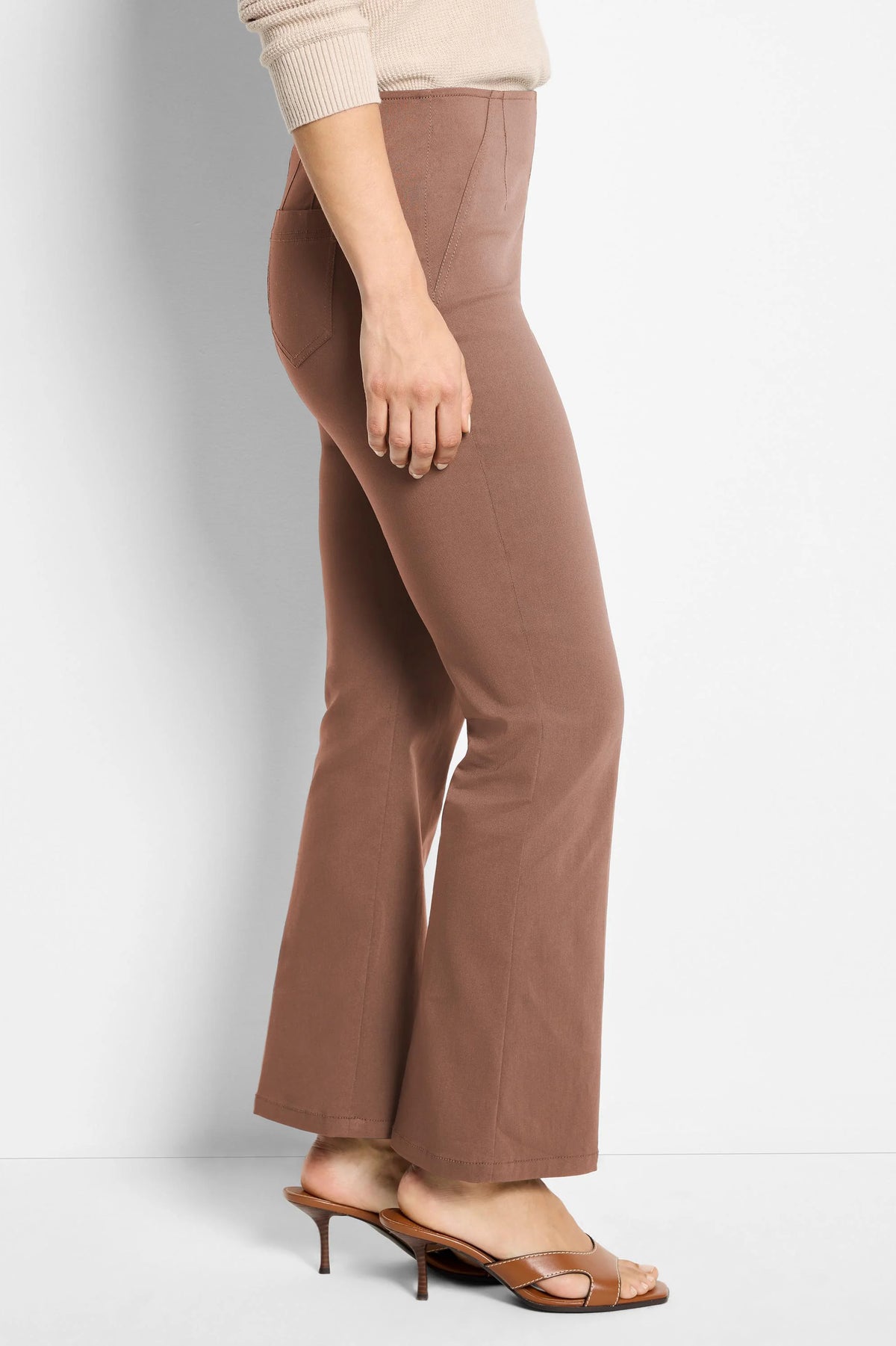 Brown high-waisted bootcut pants with visible seams and a smooth fabric finish.