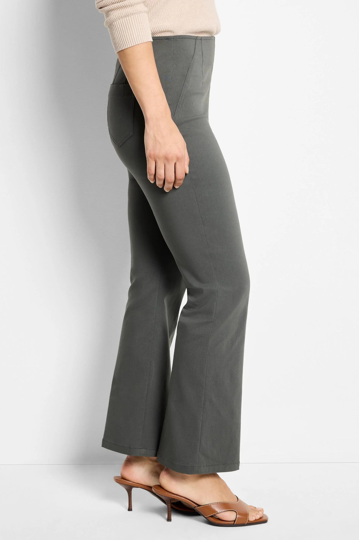 Dark grey boot-cut pants, fitted through the thigh with vertical front seams.