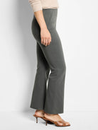 Dark grey boot-cut pants, fitted through the thigh with vertical front seams.