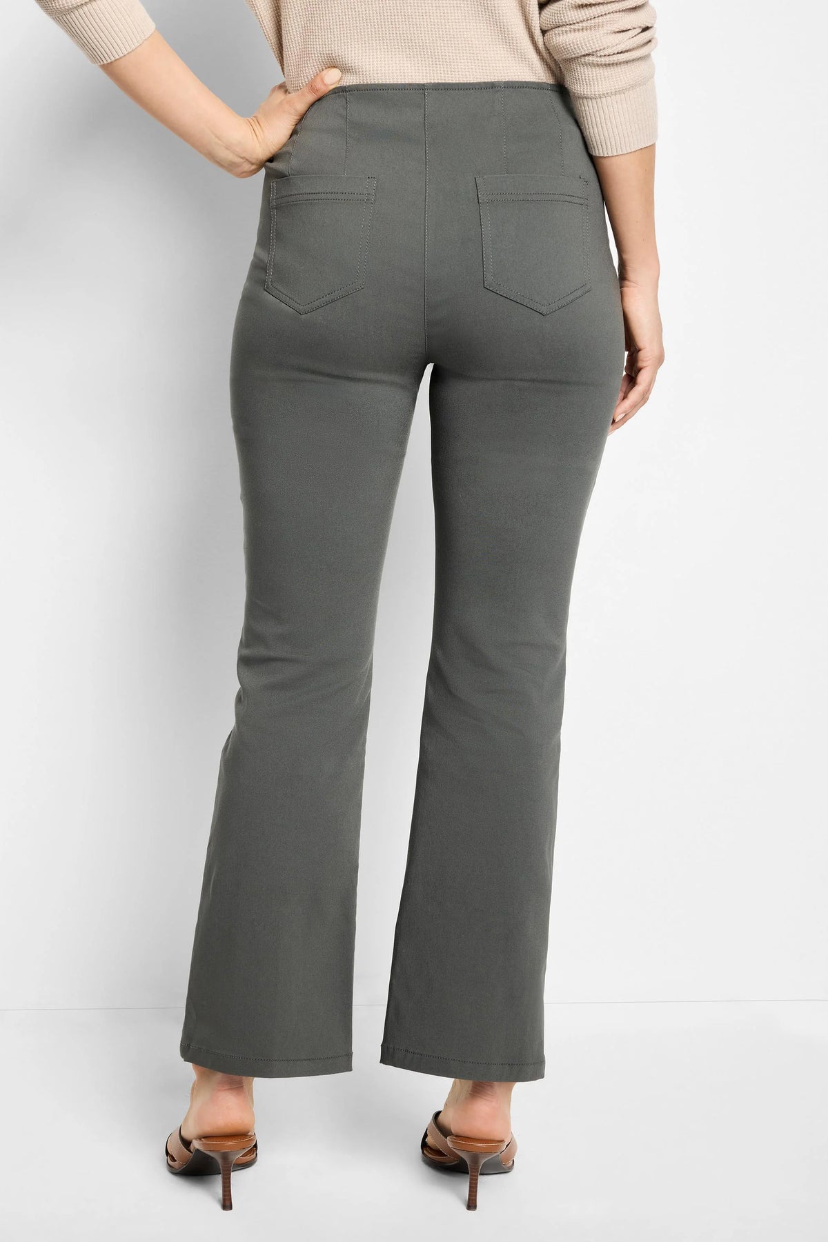 Dark olive green boot-cut pants with two back patch pockets, shown from the back.
