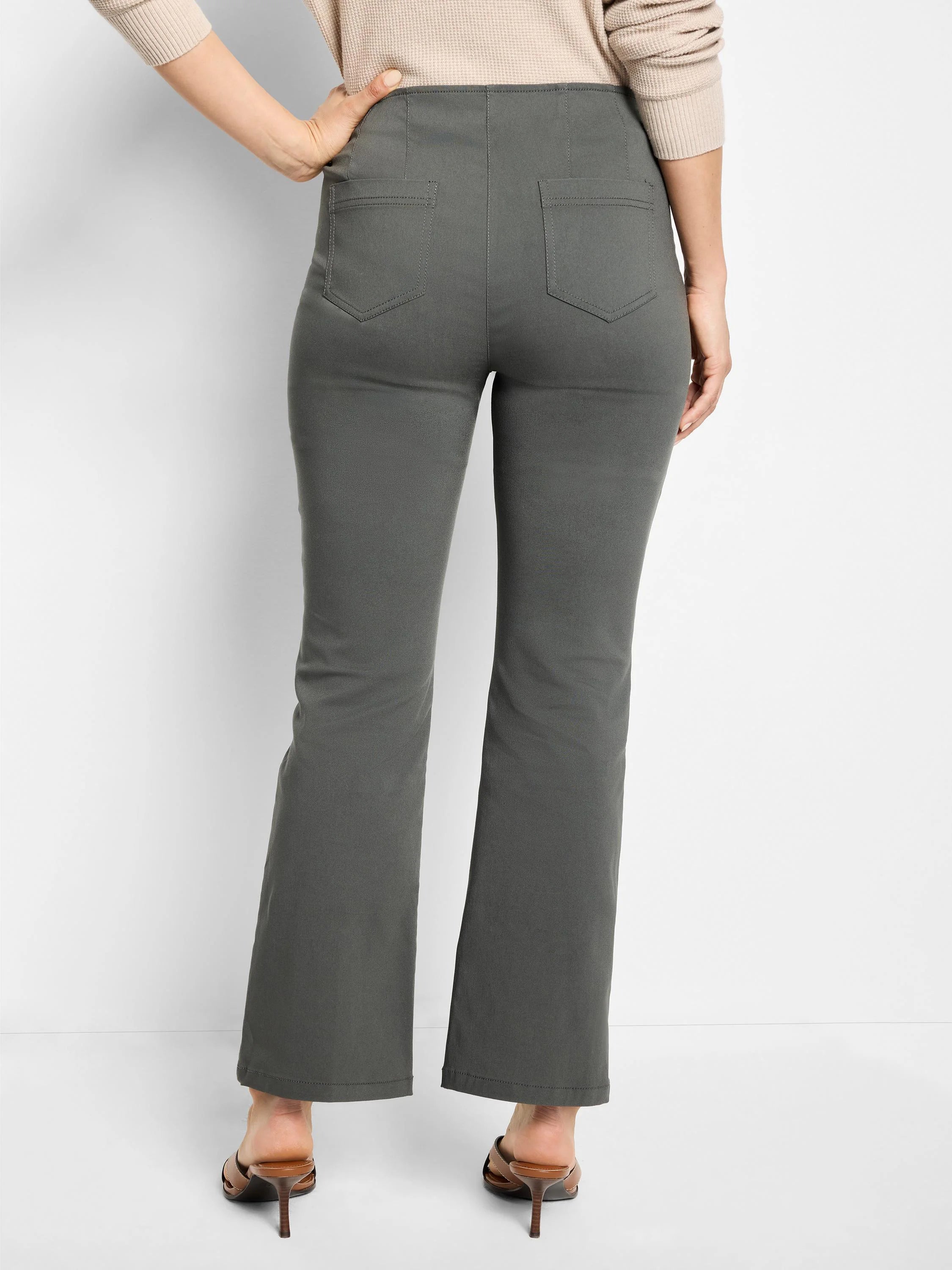Dark olive green boot-cut pants with two back patch pockets, shown from the back.