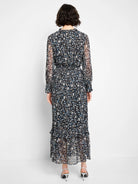 Black maxi dress, abstract blue/white/tan print. Ruffled neck, sheer sleeves, elastic waist, ruffled hem.