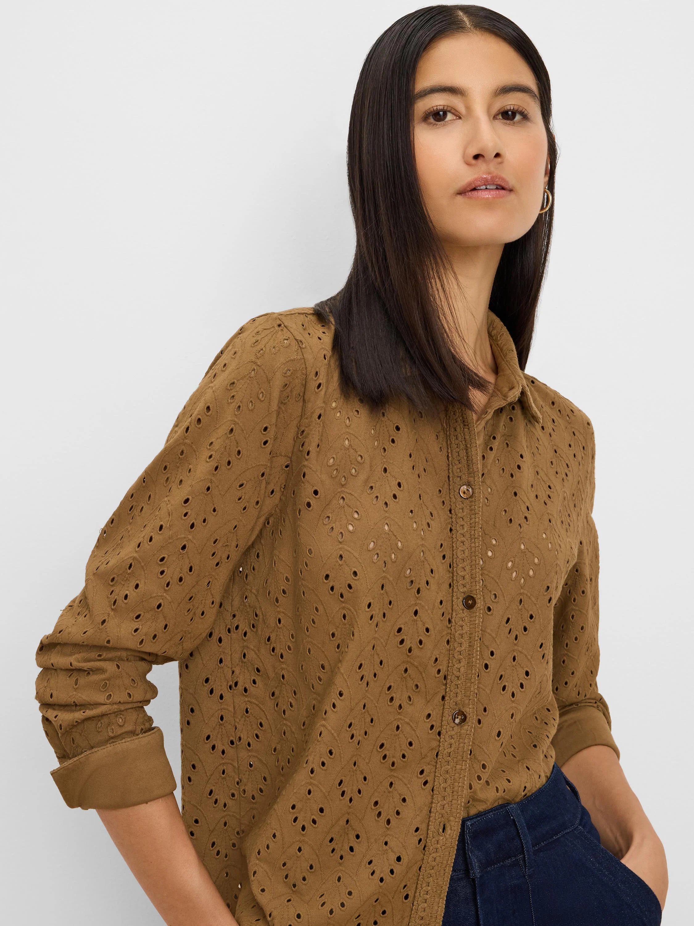 Warm brown button-front knit top with long cuffed sleeves and an all-over leaf eyelet pattern.