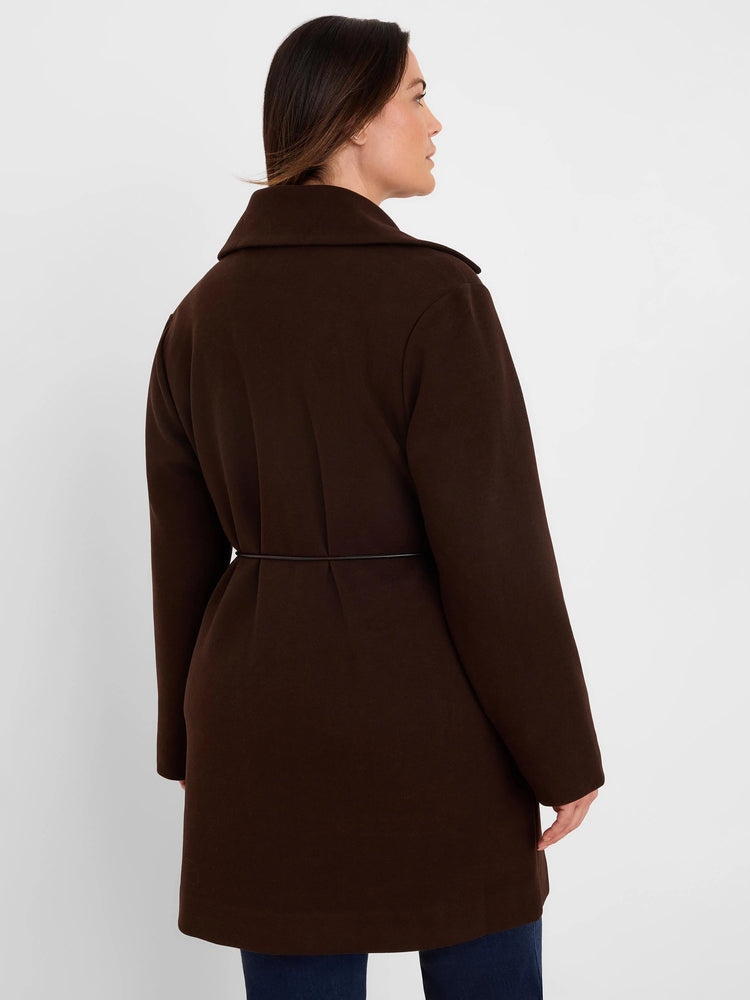 Dark brown knit twill wrap jacket with a collar and thin black waist belt. Model seen from back.