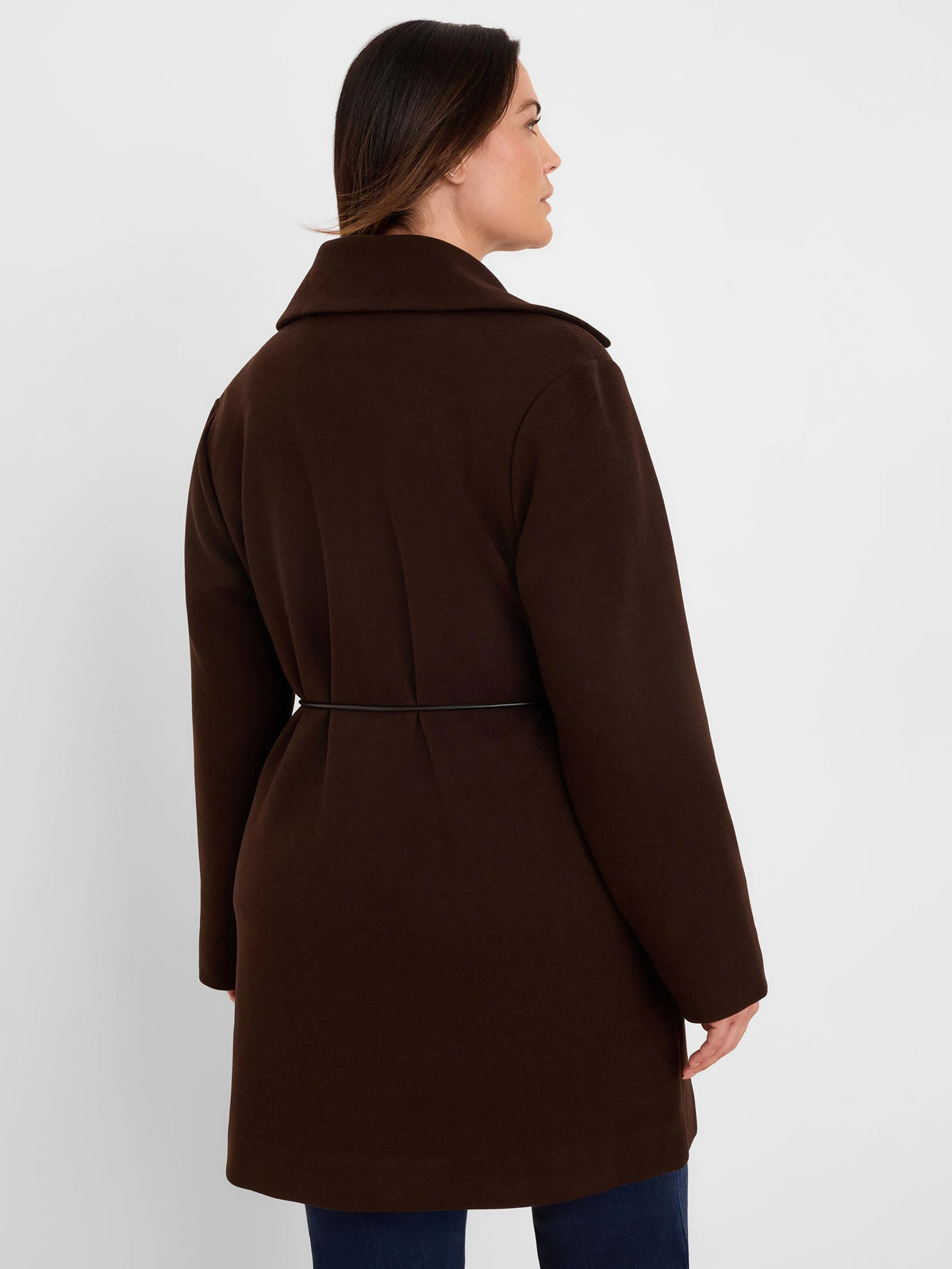 Dark brown knit twill wrap jacket with a collar and thin black waist belt. Model seen from back.