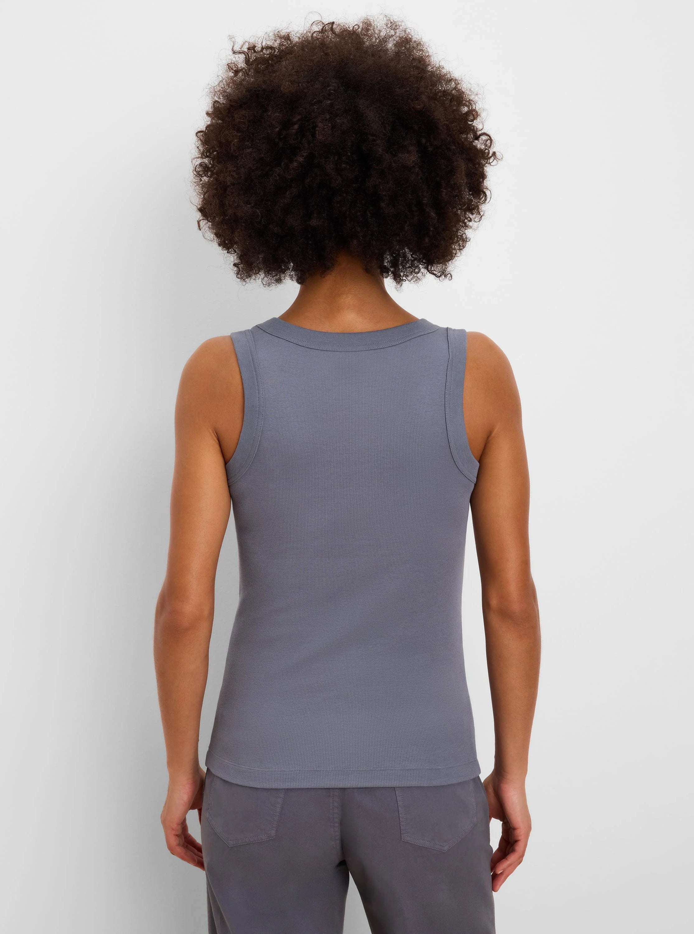 Grey ribbed knit tank top, back view. Rounded back neckline; sleeveless design.