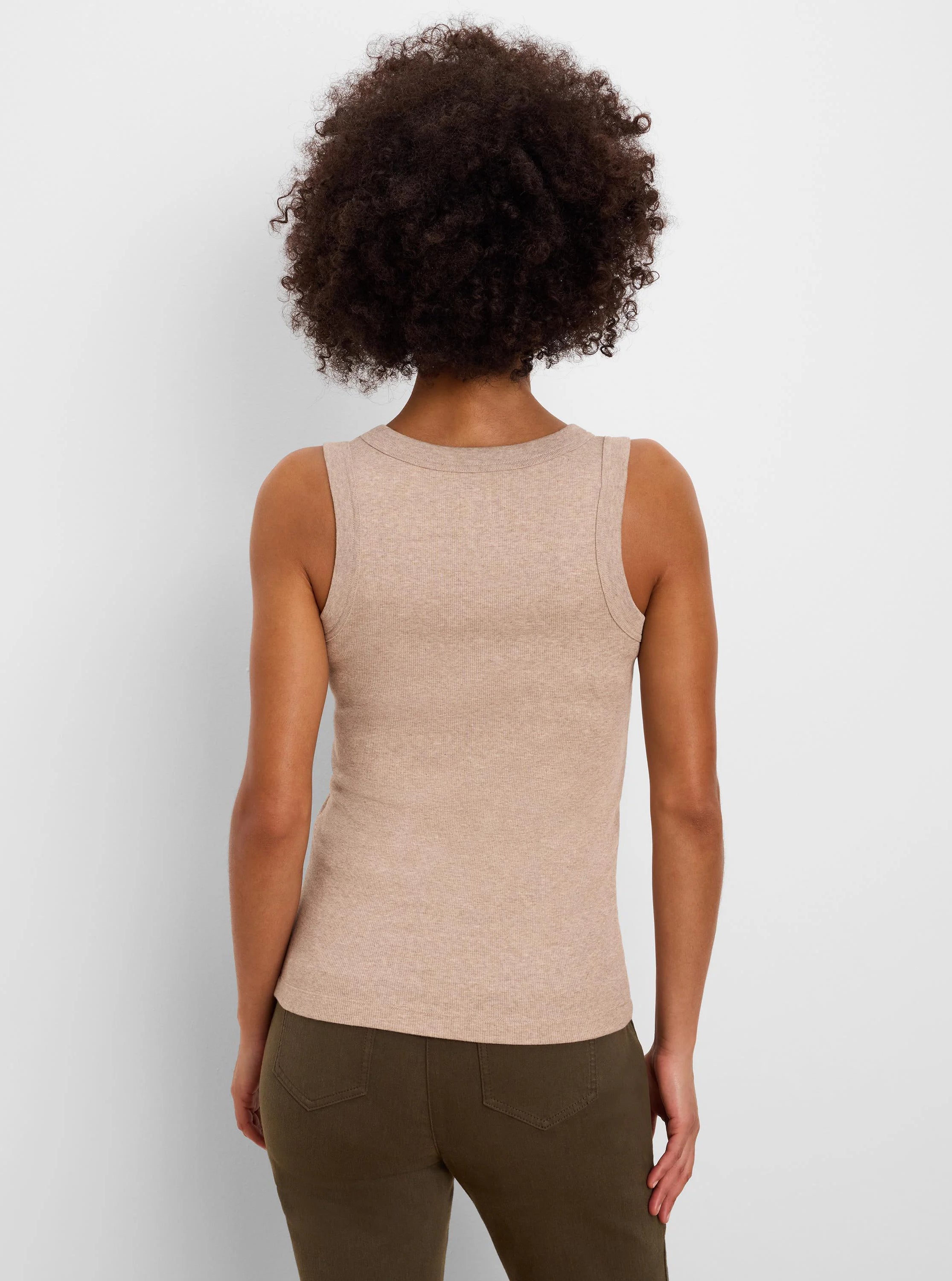 Back view: Light tan ribbed knit tank, scoop back, form-fitting.