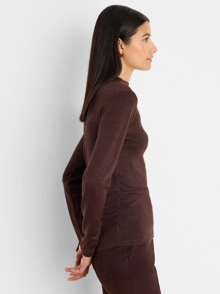 Dark brown sparkly top with side ruching, long sleeves, and high neck.