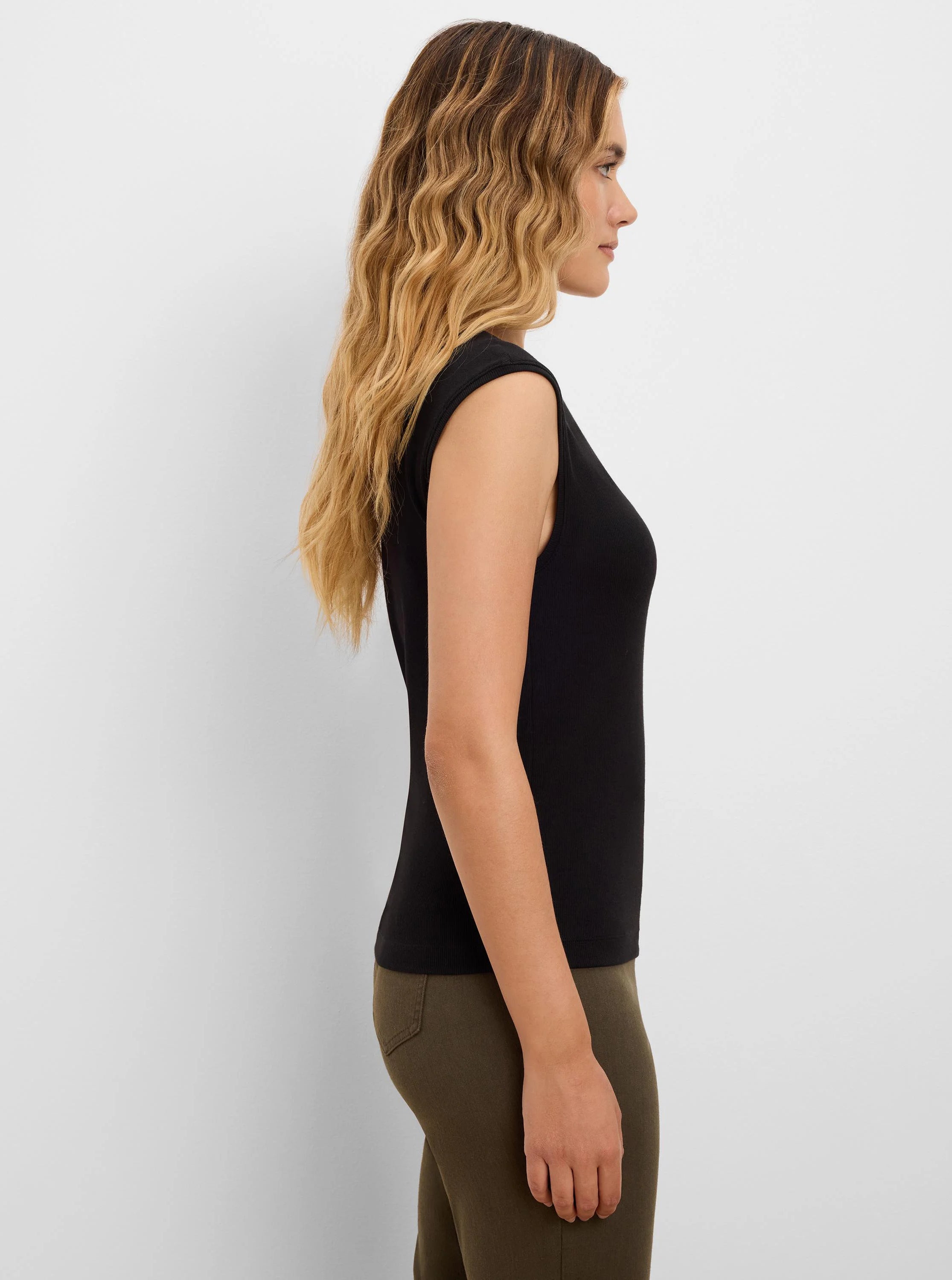 Black ribbed knit tank top. Sleeveless. Form-fitting.
