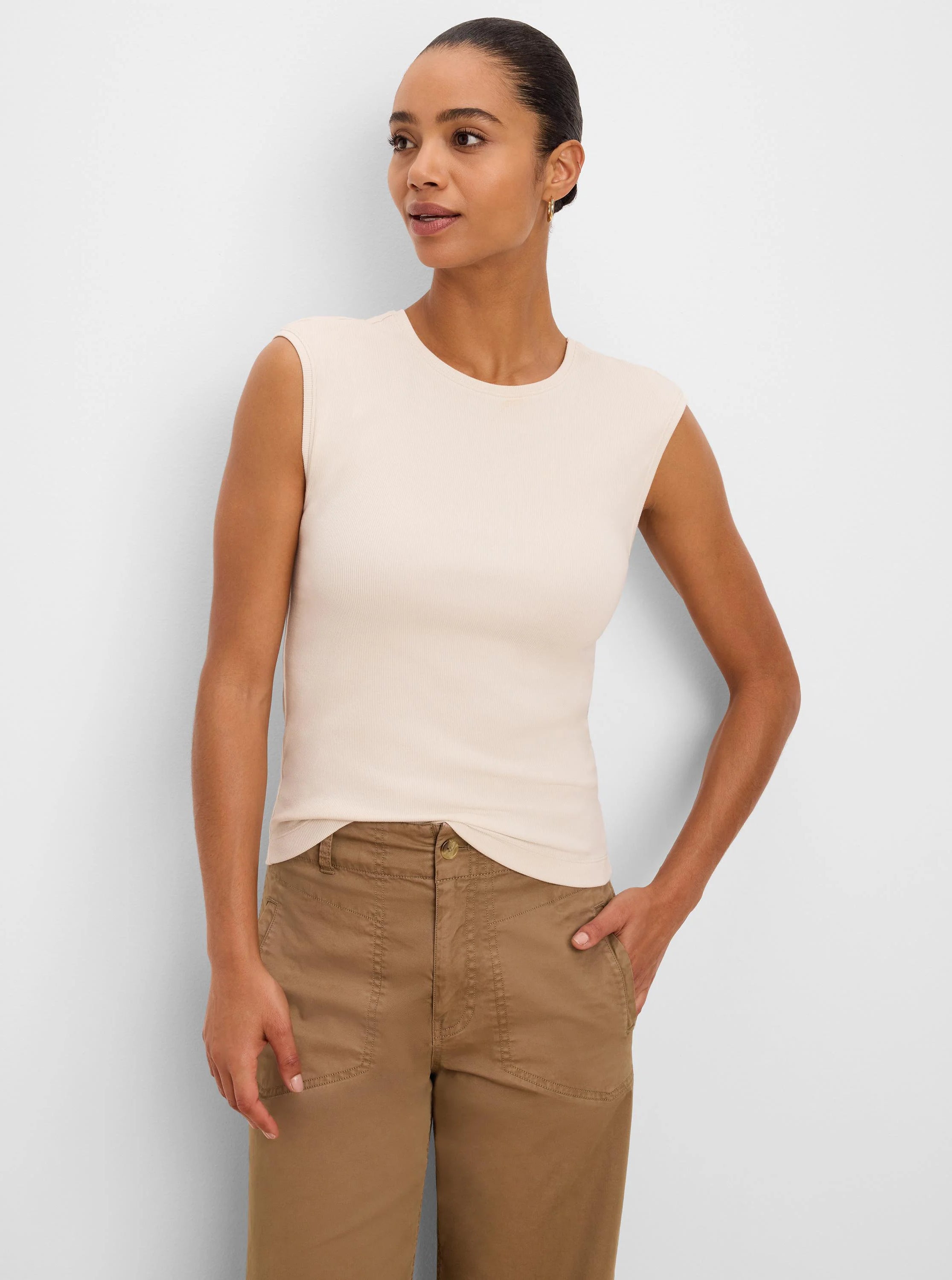 Light beige ribbed knit tank top with a crew neck and cap sleeves.