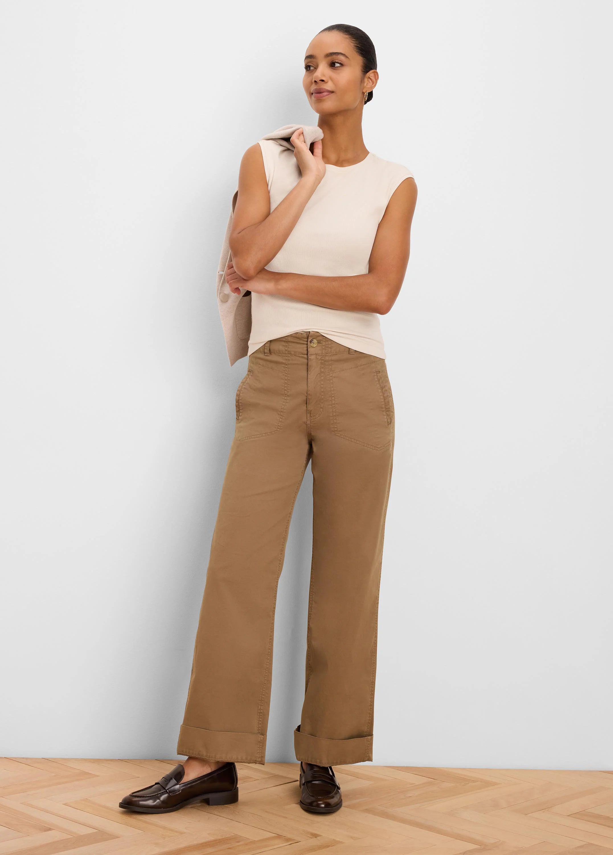 Sleeveless cream ribbed knit tank top.