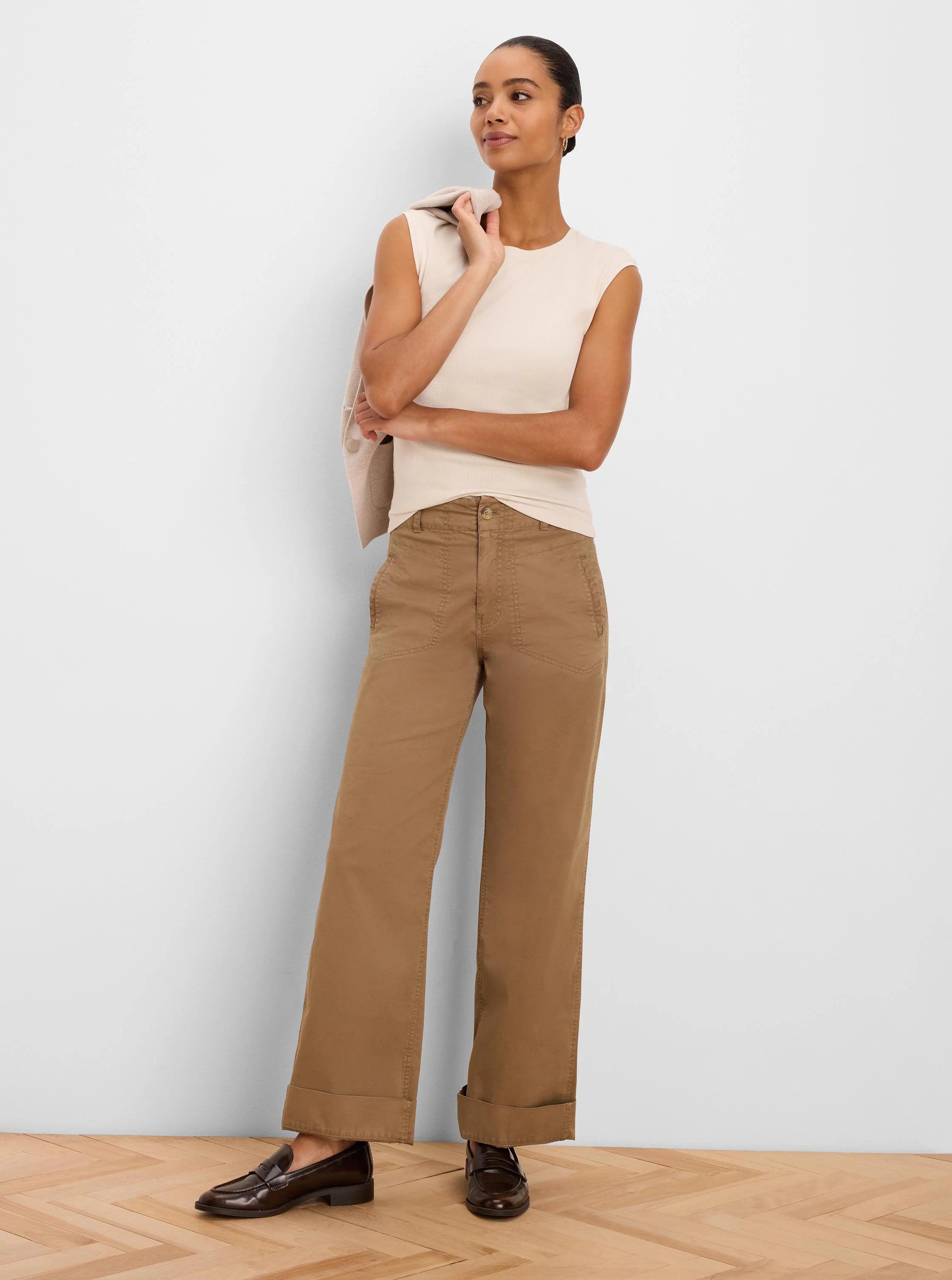 Sleeveless cream ribbed knit tank top.