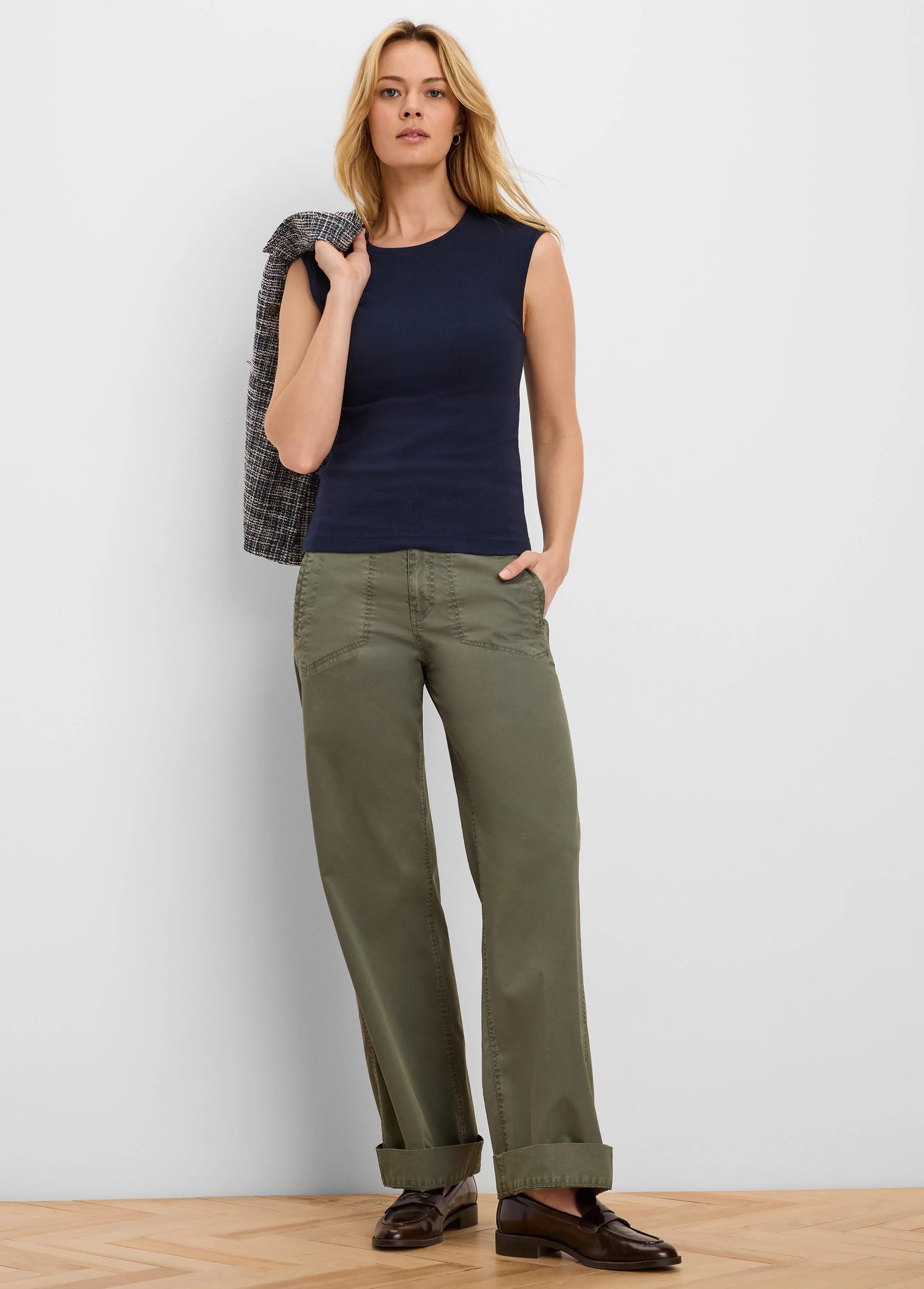 Navy blue rib-knit tank top, sleeveless with a round neckline.