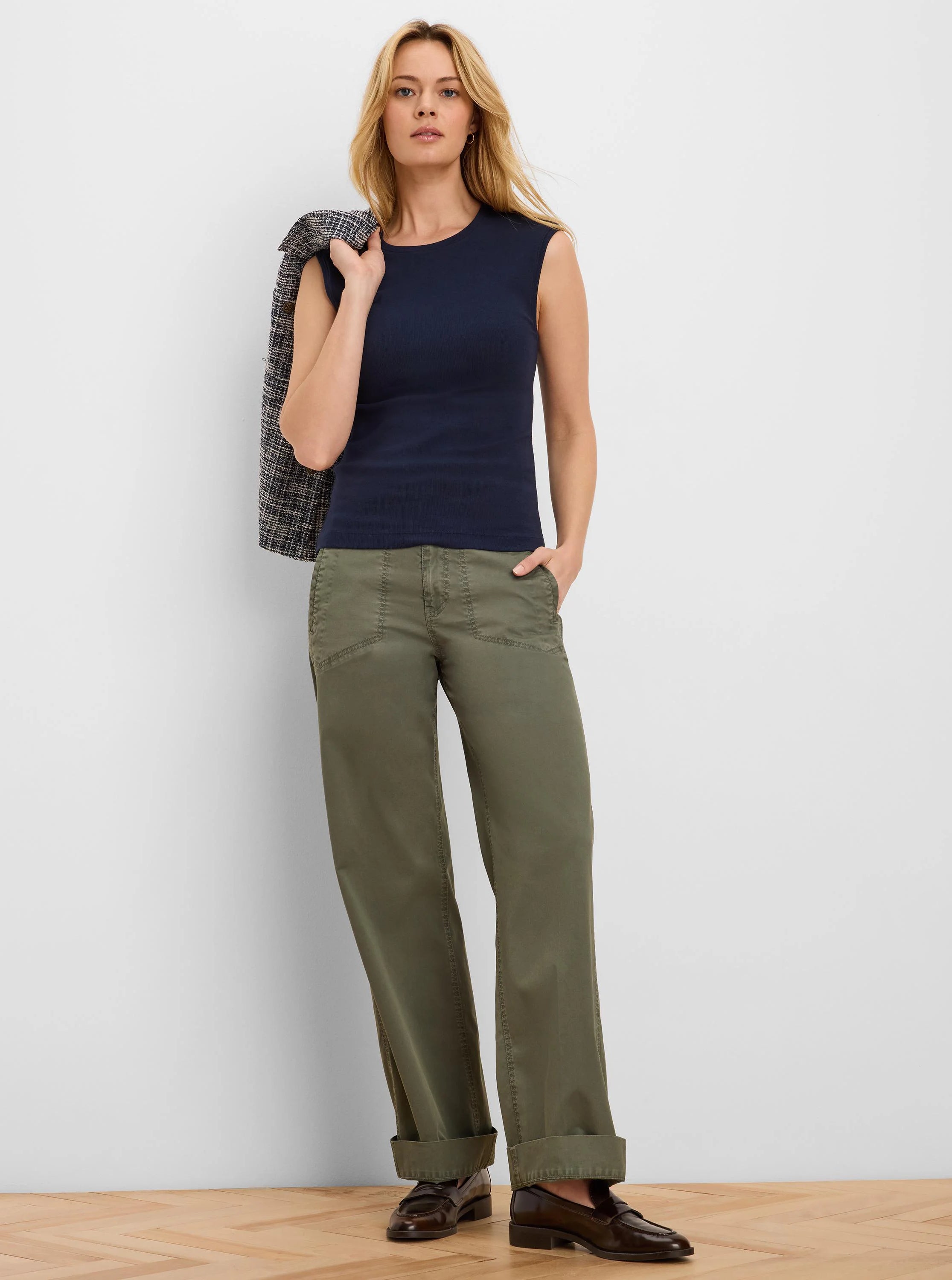Navy blue rib-knit tank top, sleeveless with a round neckline.