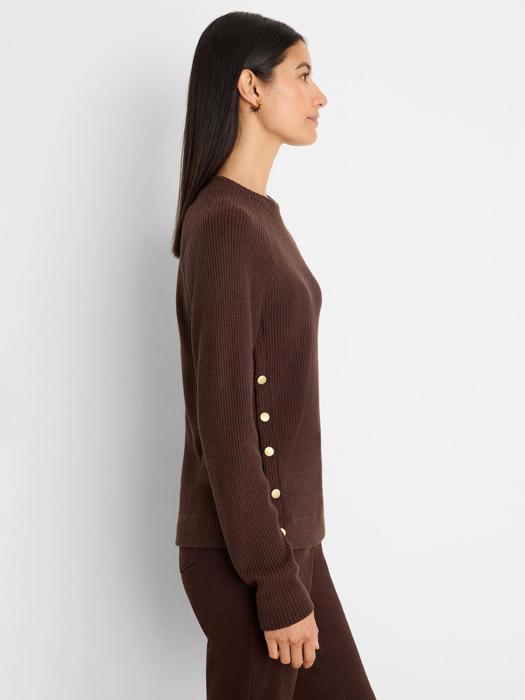 Dark brown waffle knit top, long sleeves, with 5 gold buttons vertically down the side.