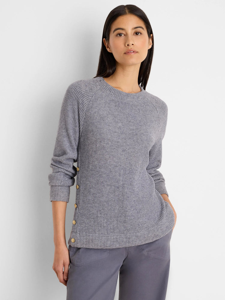 Grey waffle knit top with long sleeves, crew neck, and gold buttons down the left side.