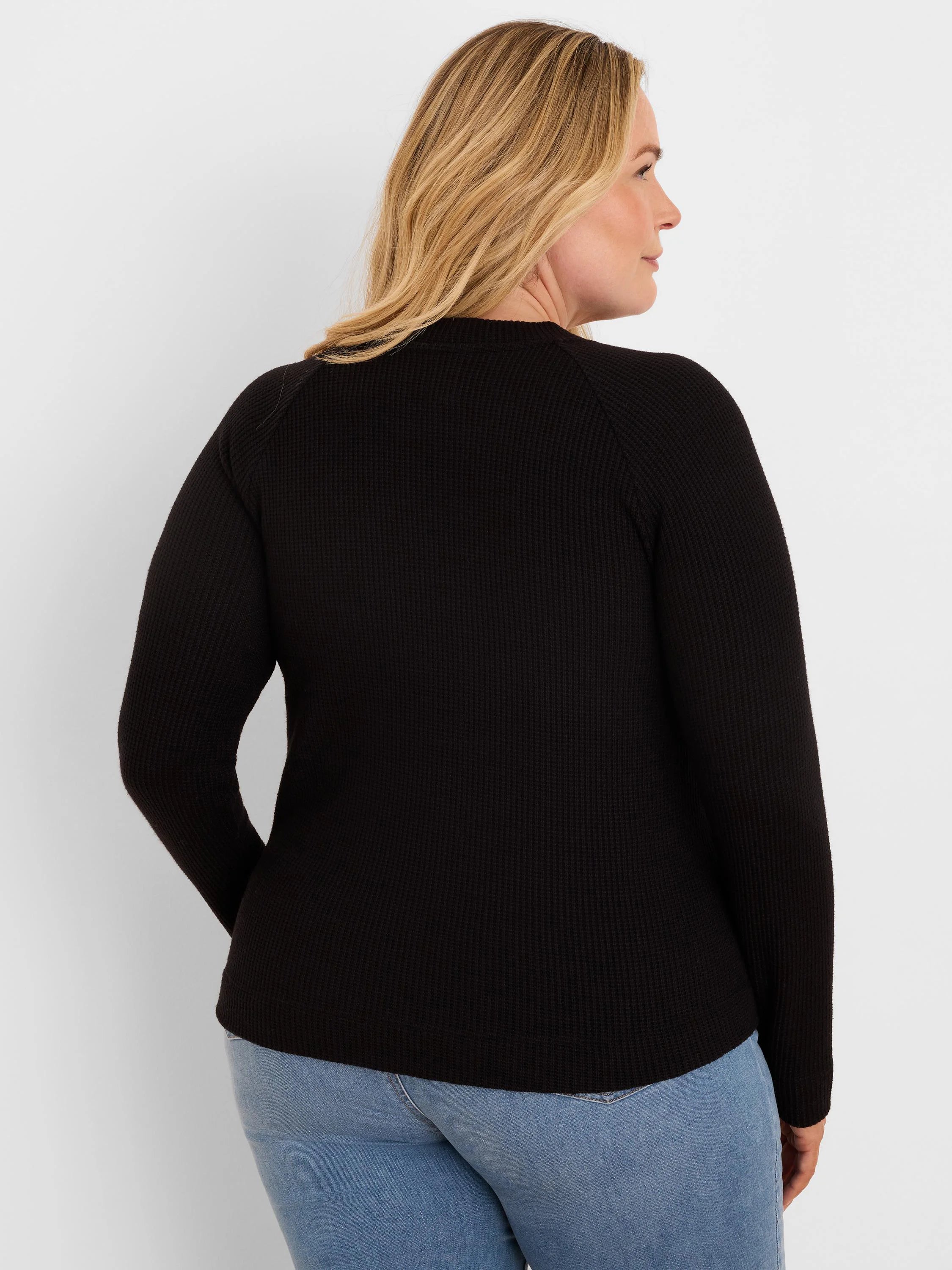 Black waffle knit long-sleeve top with a crew neck, viewed from the back.
